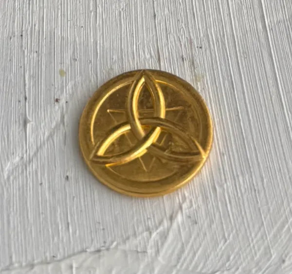 Conjunto de Moneda con el símbolo de Triqueta